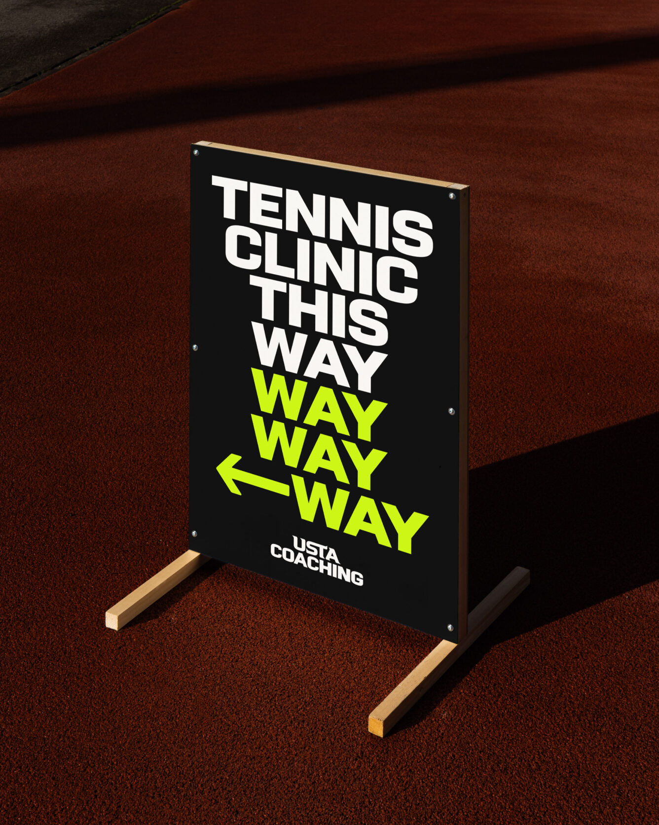 A banner giving the direction for USTA coaching tennis clinic