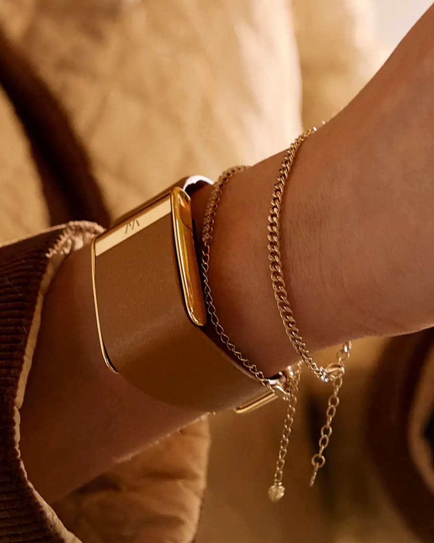 Woman wearing premium smart wearable tracker with integrated biometric sensors and minimalist industrial design