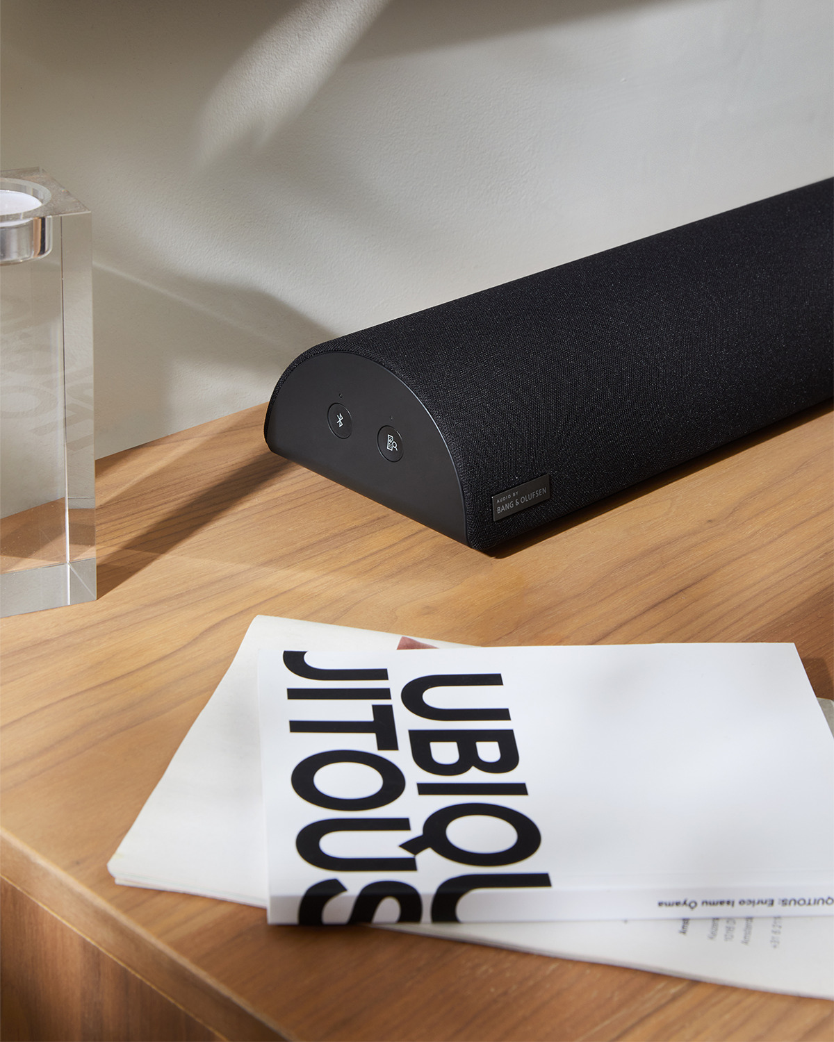 Verizon branded home audio speaker with unique half-cylinder form