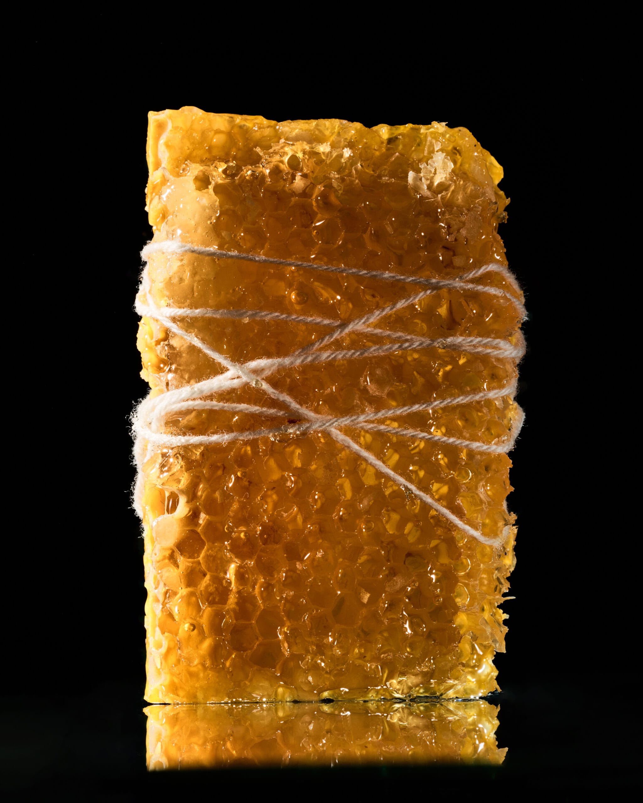 Close-up of golden wrapp with white string