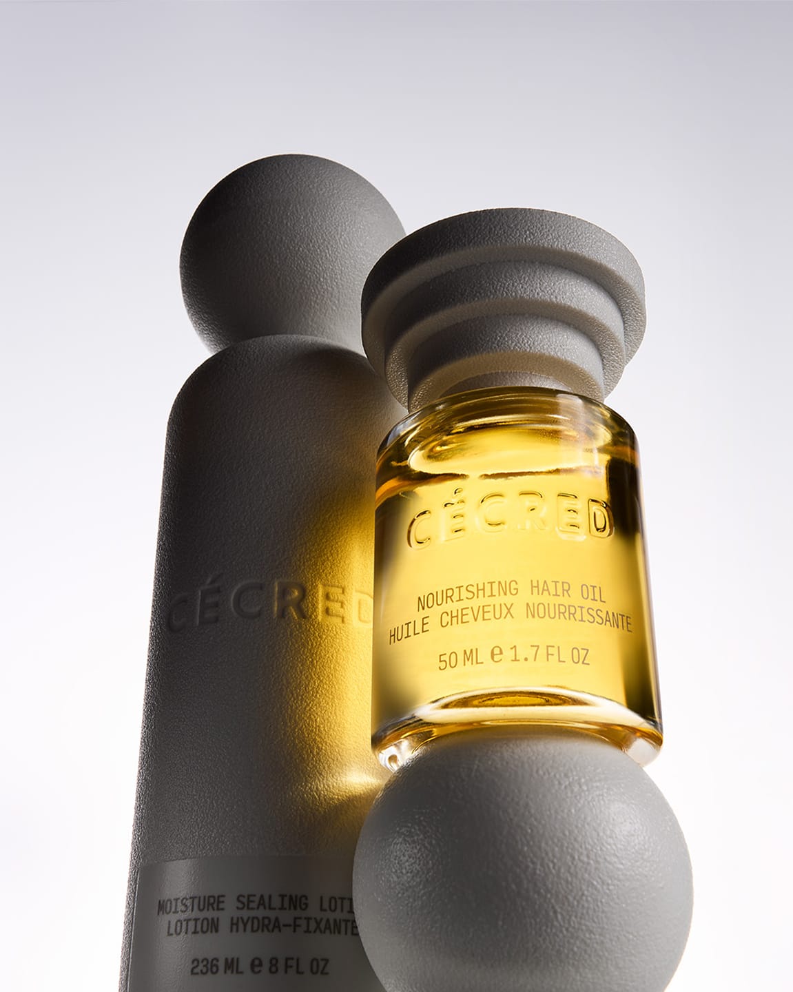 Cecred nourishing hair oil and moisture sealing lotion bottle