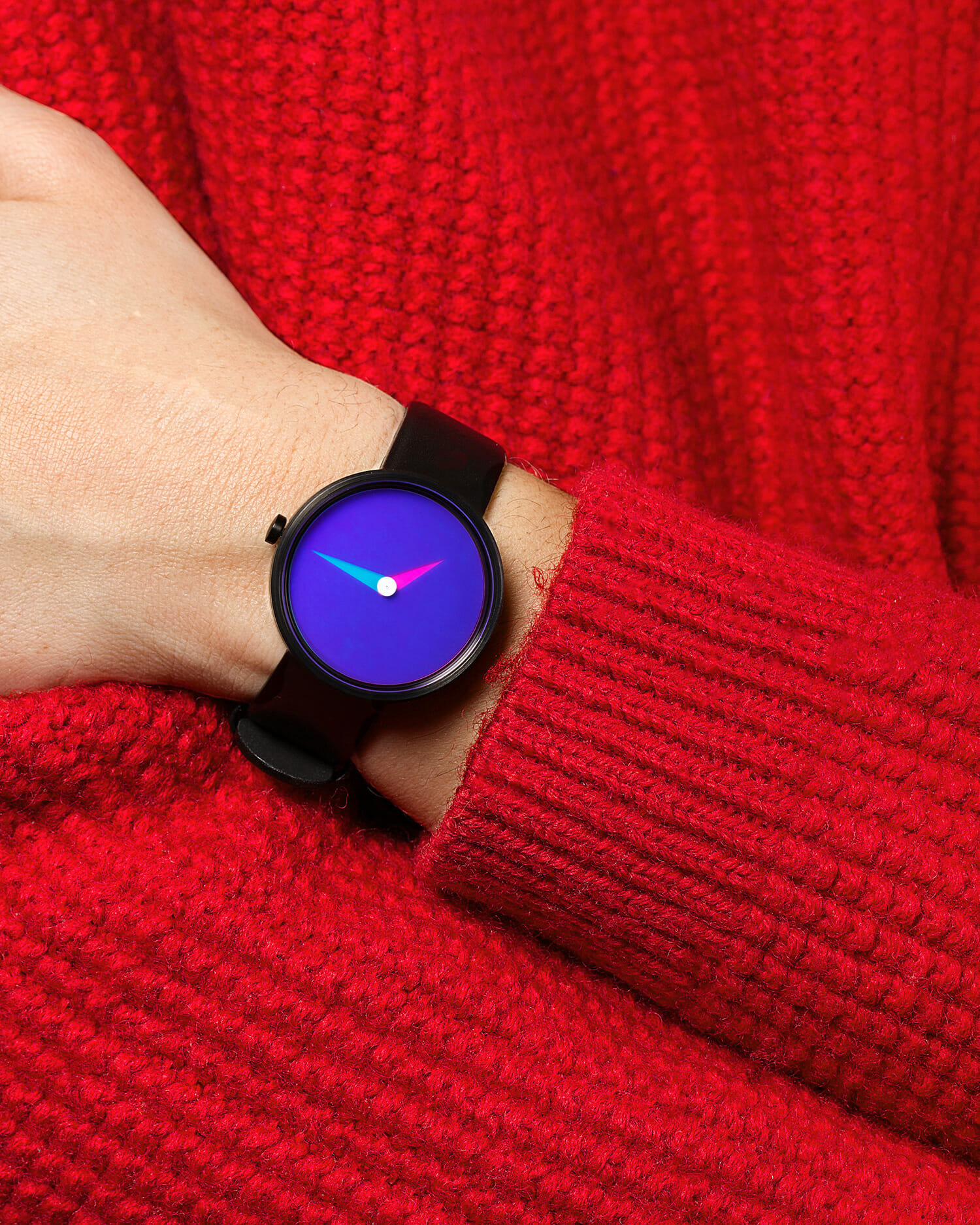 Watch from moma design store featuring a purple gradient face worn with a red knit sweater.