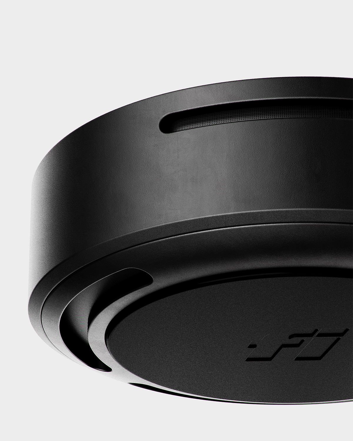 Close-up of a Fi smart dog collar in black, featuring premium hardware and charging base.