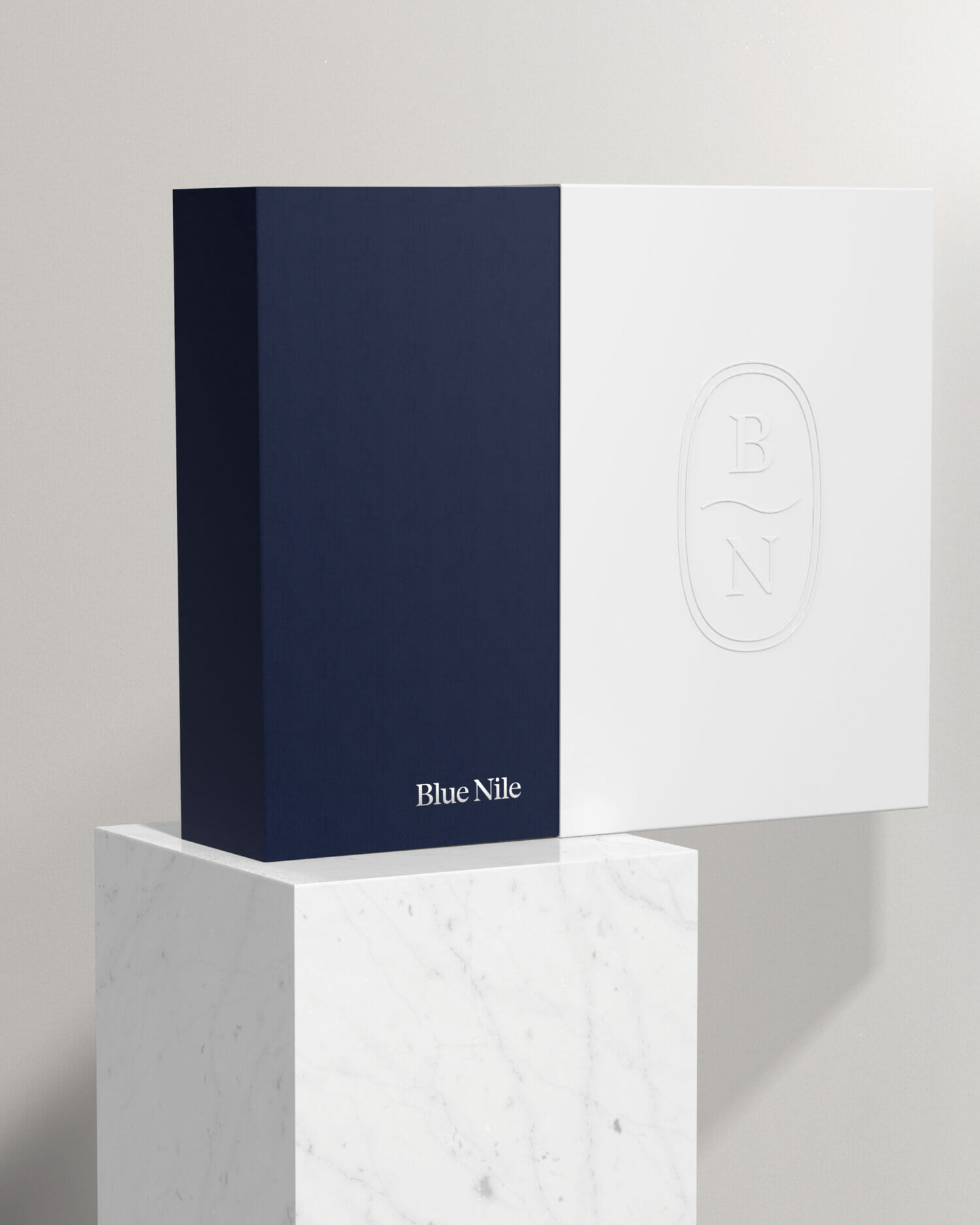 Blue nile gift box featuring a navy and white design with embossed BN monogram branding,