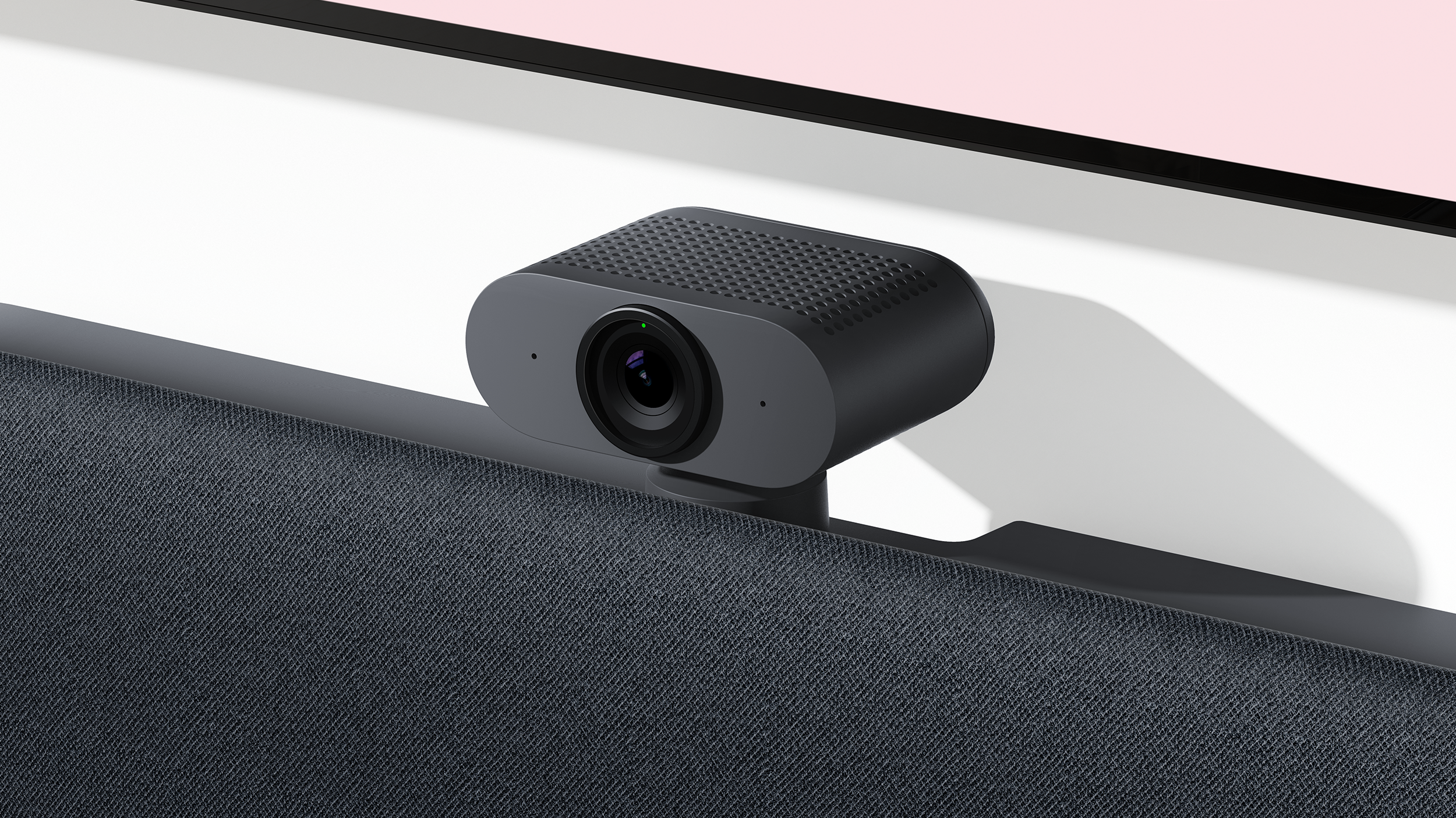 Modern Google Meet setup featuring a desktop screen with an integrated camera mounted above the display for high-quality video conferencing.